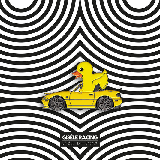 MX-5 · Duck — Gisèle Racing enamel pin on its backing card